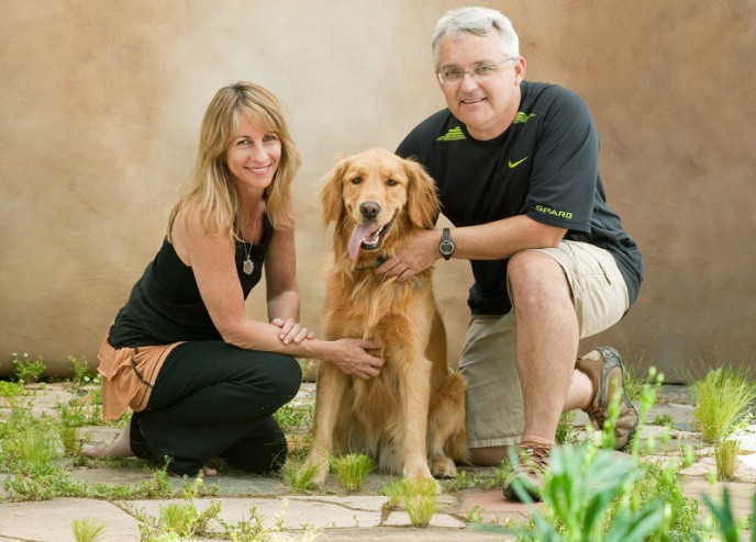 Portrait of a Golden Retriever and his owners